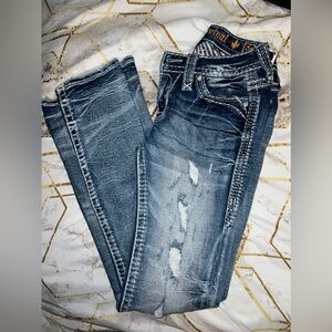 Rock Revival Boot Cut ripped jeans, dark wash color, mid-rise.